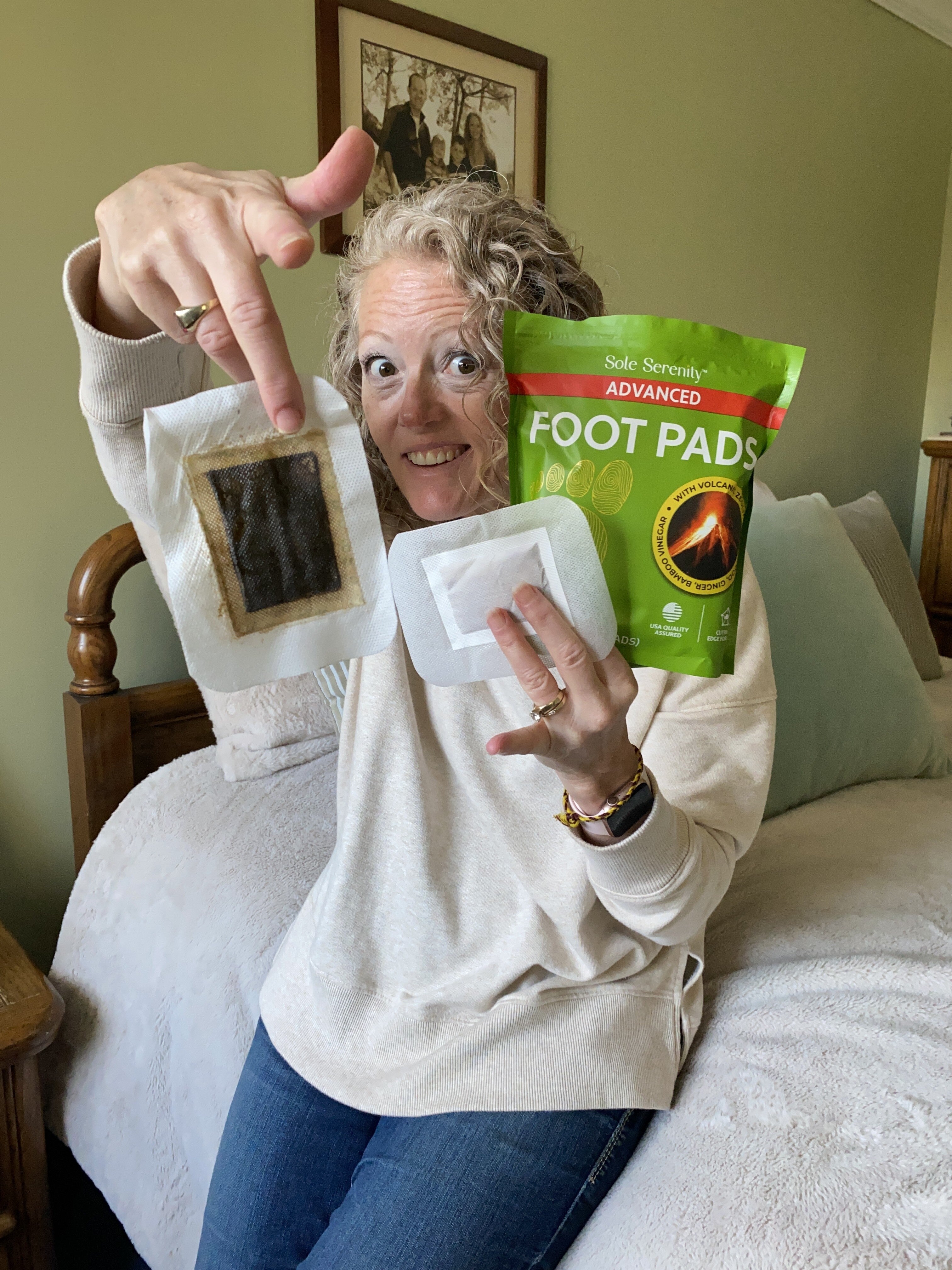 Lure Essentials Advanced Zeolite Detox Foot Pads applied to soles, showing their adhesive surface and packaging.