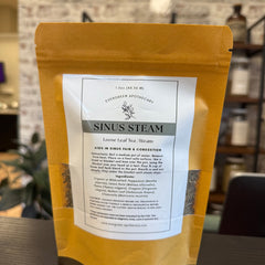 Aromatic sinus steam from Evergreen Apothecary, featuring a glass bowl with herbal steam for nasal relief and relaxation.