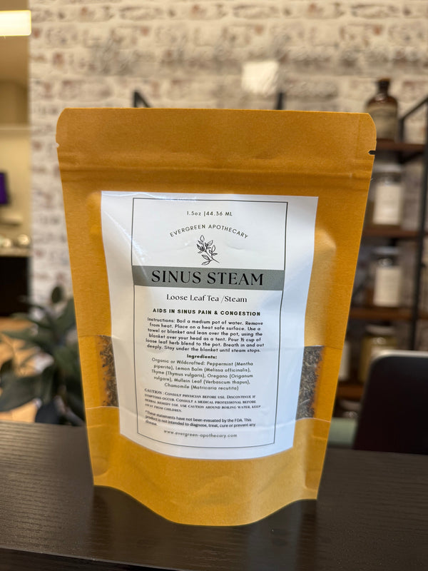 Aromatic sinus steam from Evergreen Apothecary, featuring a glass bowl with herbal steam for nasal relief and relaxation.