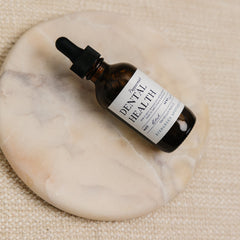 Evergreen Apothecary Dental Health Oil Brushing peppermint oral supplement bottle with label and cap.