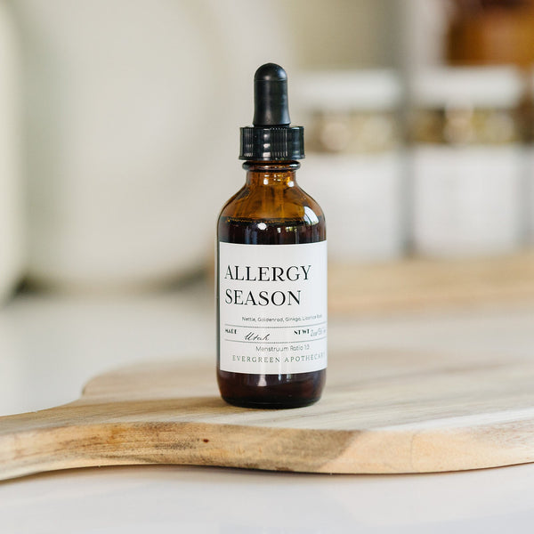 Evergreen Apothecary Allergy Season tincture bottle with label, natural remedy for allergy relief, in a clean setting.
