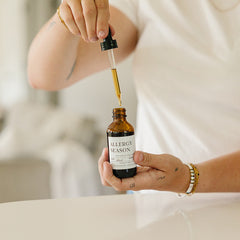 Evergreen Apothecary Allergy Season tincture bottle with label, natural remedy for allergy relief in a clear glass container.