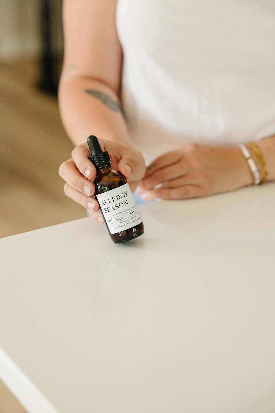 Evergreen Apothecary Allergy Season tincture bottle with label, herbal remedy for allergy relief, natural health supplement.