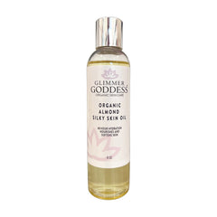 Organic Sweet Almond Silky Skin Oil by Glimmer Goddess, a moisturizing lotion providing 48-hour hydration for soft, smooth skin.