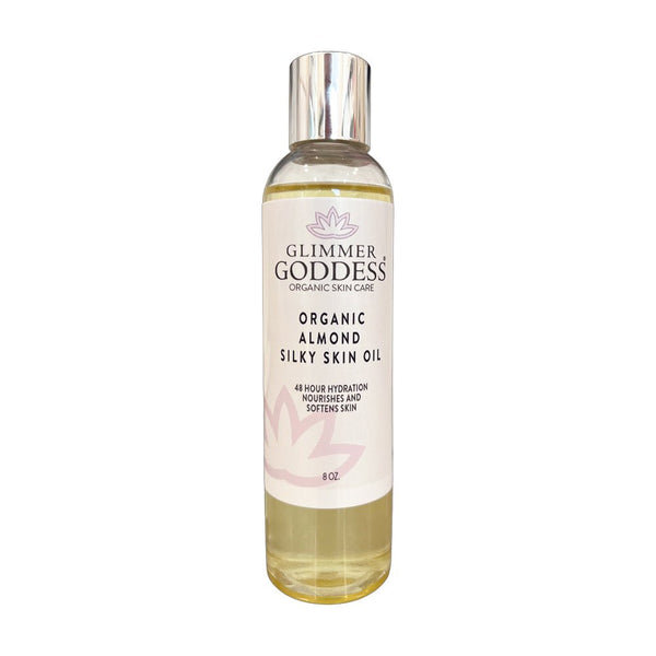 Organic Sweet Almond Silky Skin Oil by Glimmer Goddess, a moisturizing lotion providing 48-hour hydration for soft, smooth skin.