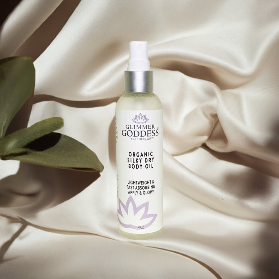 Organic Silky Dry Body Oil by Glimmer Goddess® Organic Skin Care, showing a sleek bottle of fast-absorbing moisturizing body oil.