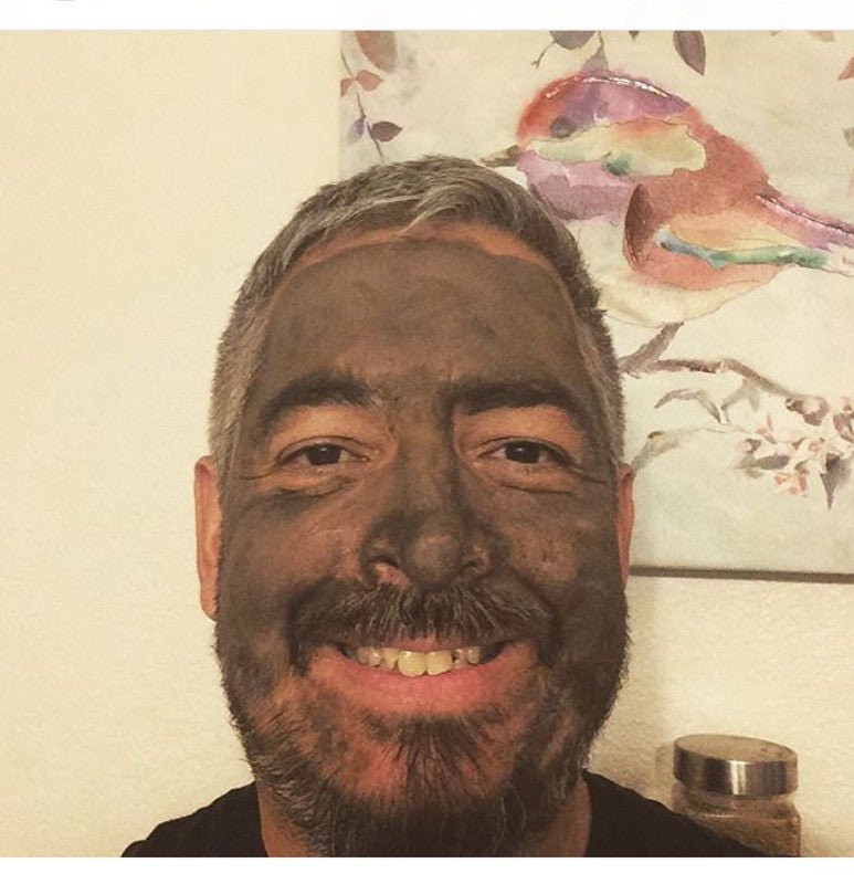 Glimmer Goddess Organic Dead Sea Mud Mask for exfoliating and rejuvenating skin, featuring a 2 oz jar of natural skincare mask.