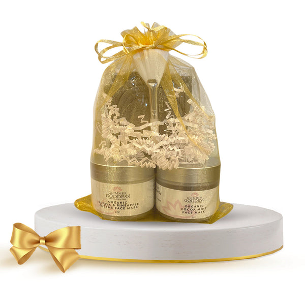 Glimmer Goddess Organic Face Mask Gift Set with 2 masks, spa headband, and applicator brush for at-home facial skincare.