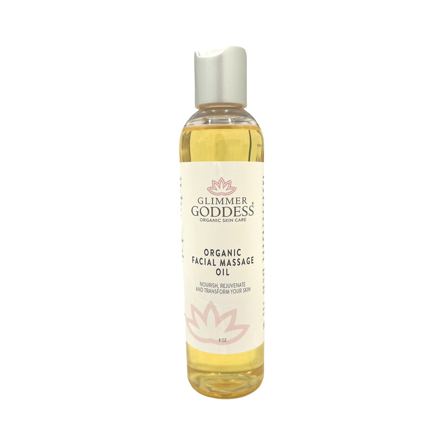 Organic Facial Massage Oil by Glimmer Goddess, a natural moisturizer for anti-aging skincare, shown in a clear glass bottle.