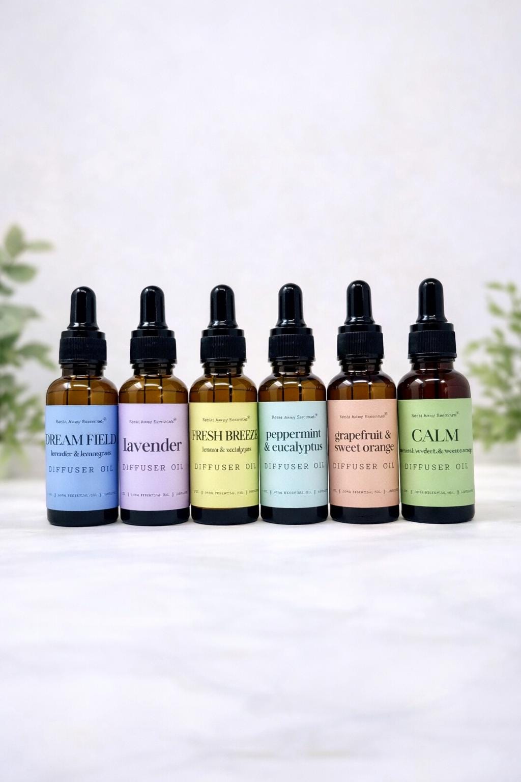 Relax Away Essentials aromatherapy diffuser oils in 1 oz bottles with lavender, peppermint, and citrus scents for stress relief.