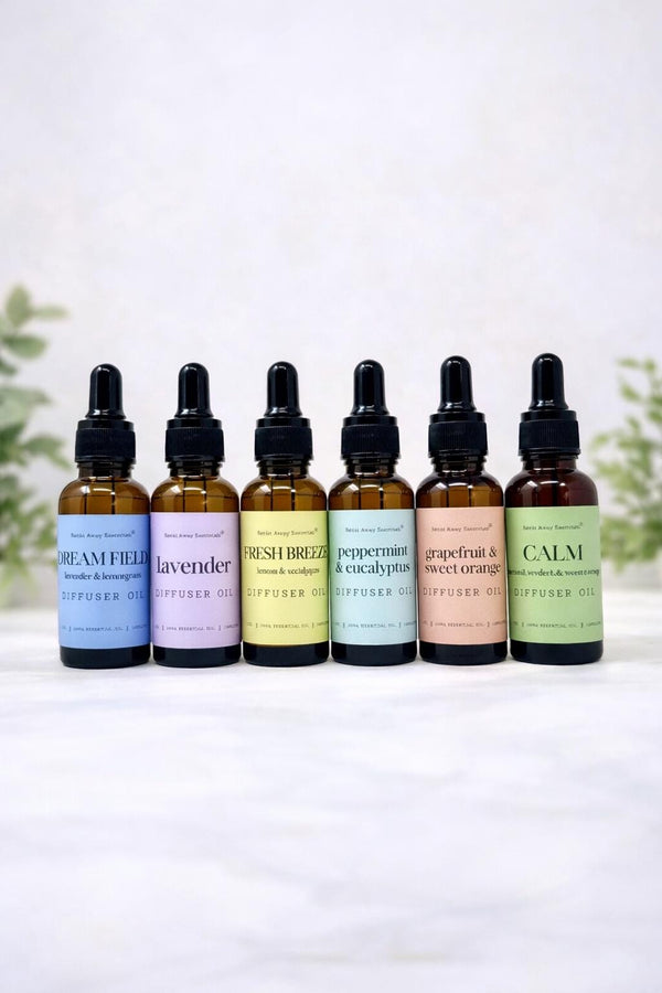Relax Away Essentials aromatherapy diffuser oils in 1 oz bottles with lavender, peppermint, and citrus scents for stress relief.