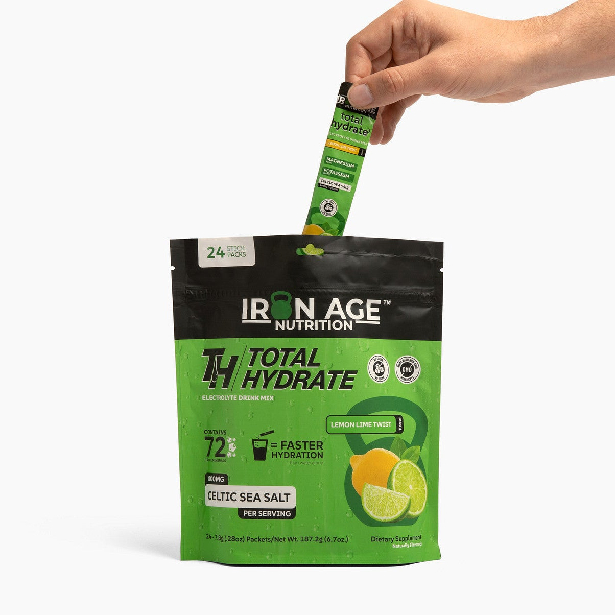 Iron Age Nutrition Total Hydrate electrolyte powder in Lemon Lime Twist, shown in a scoop with lemon-lime flavor powder.