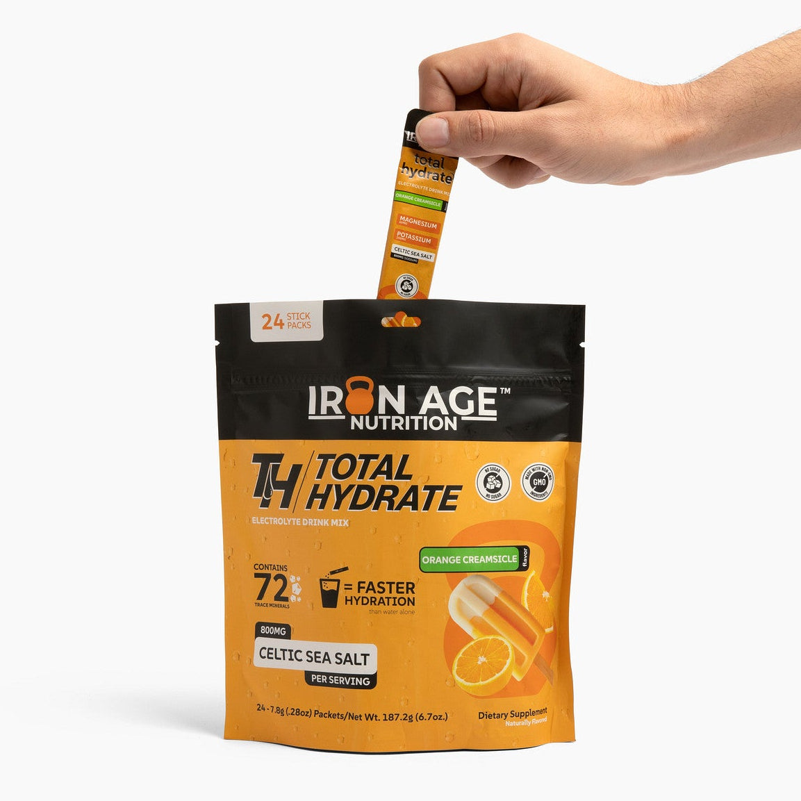 Iron Age Nutrition Total Hydrate electrolyte powder in Orange Creamsicle flavor, showing the vibrant orange and cream-colored powder.