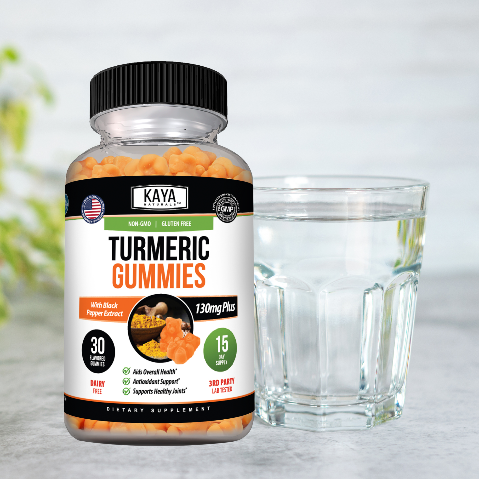 Kaya Naturals turmeric gummies in a clear glass jar, showing orange turmeric-flavored gummy candies.