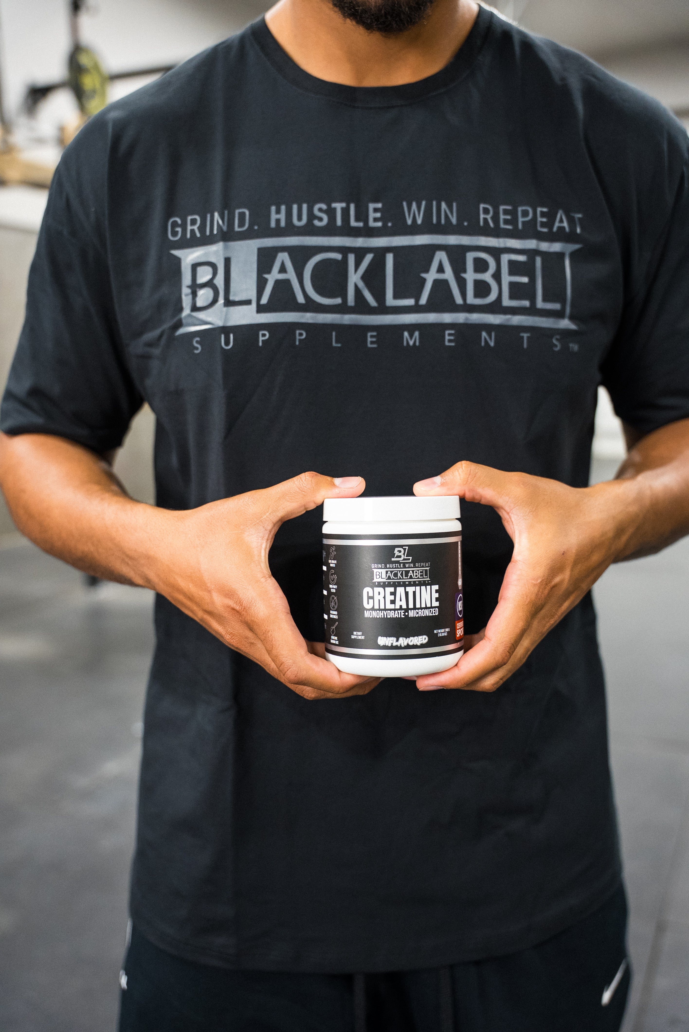 BlackLabel Supplements Black Logo T-Shirt featuring a black fabric with the brand's logo printed on the front.