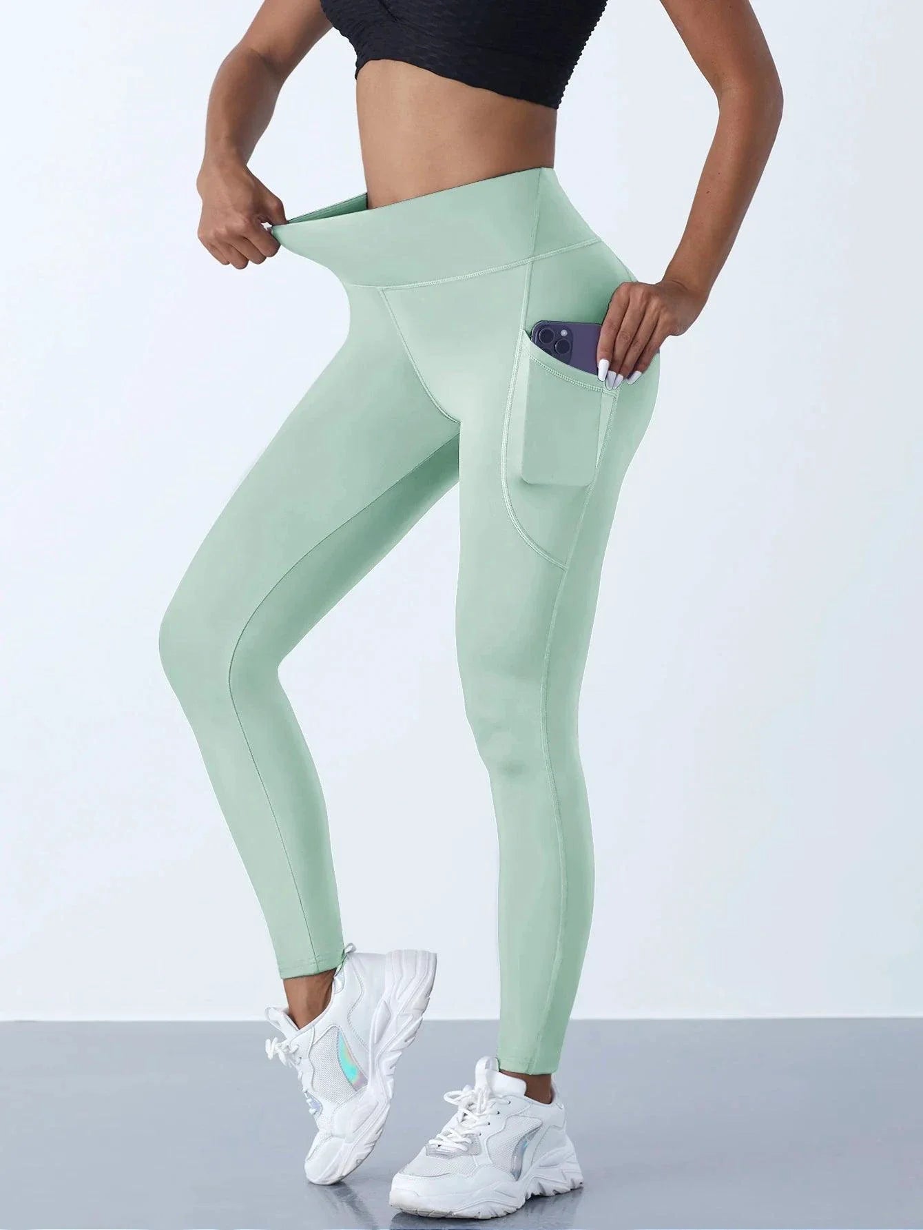 Mandotos high waist women’s leggings with stretch fabric, pockets, and push-up design, ideal for yoga, running, and fitness activities.
