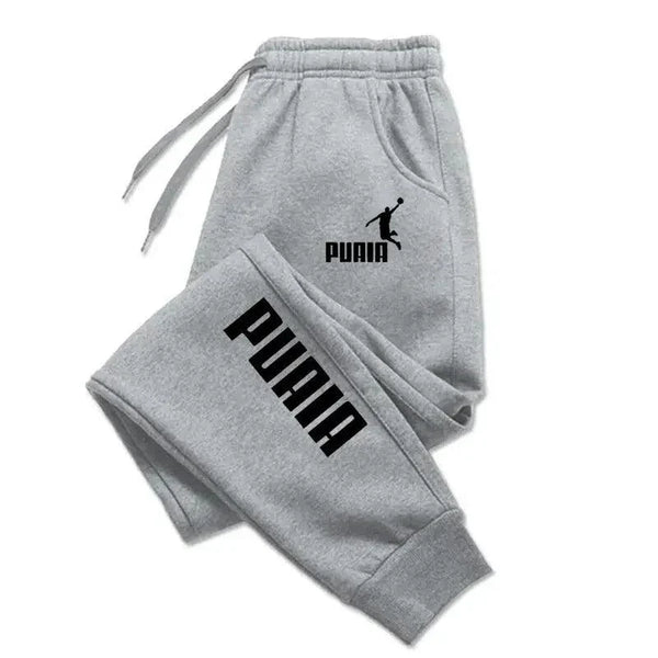 Mandotos PUAIA print men's jogger pants in solid color, featuring a sporty, loose fit design for autumn and winter streetwear.