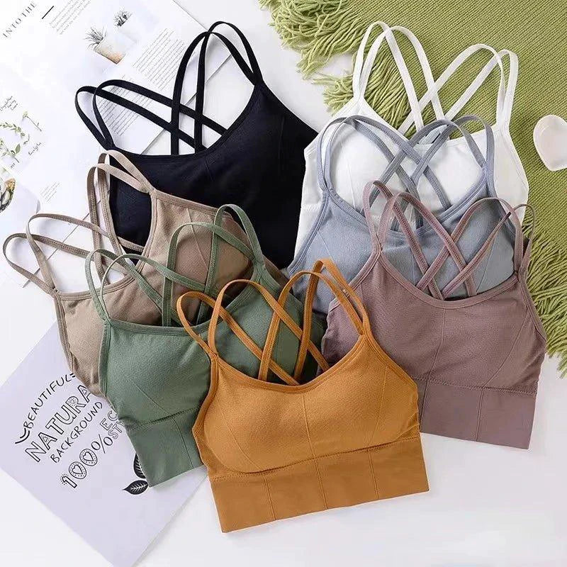 Mandotos women's sports bra with back cross straps, push-up design, breathable fabric, solid color, ideal for yoga and fitness.