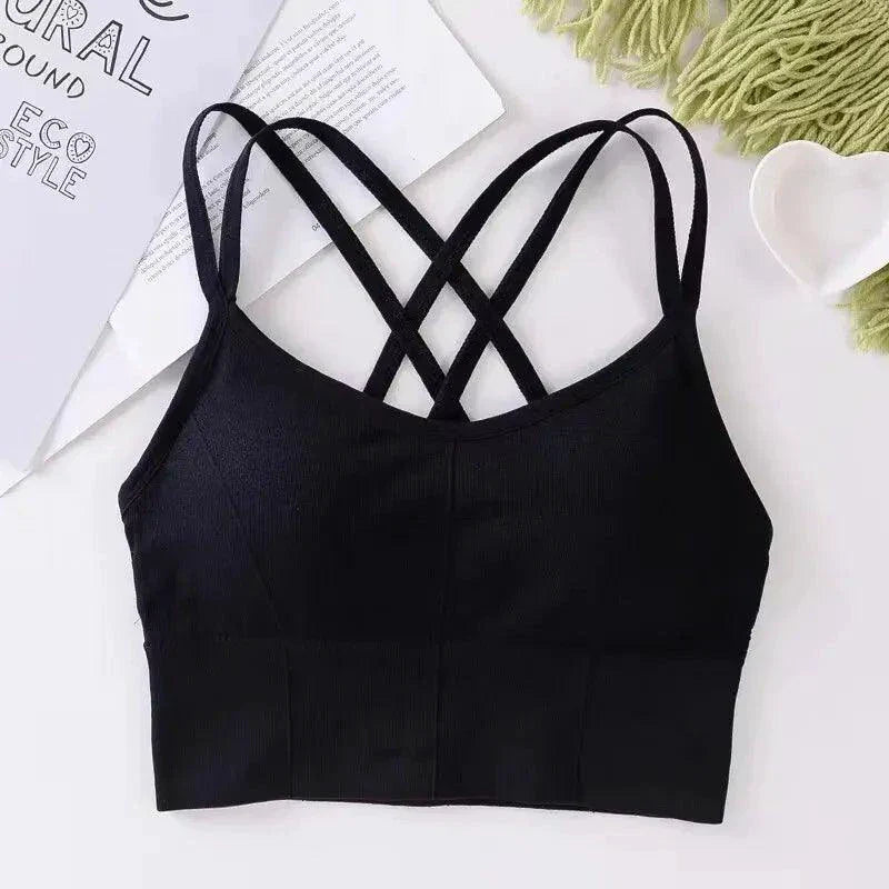 Mandotos women's sports bra with back cross straps, push-up design, breathable fabric, solid color, ideal for yoga and running.