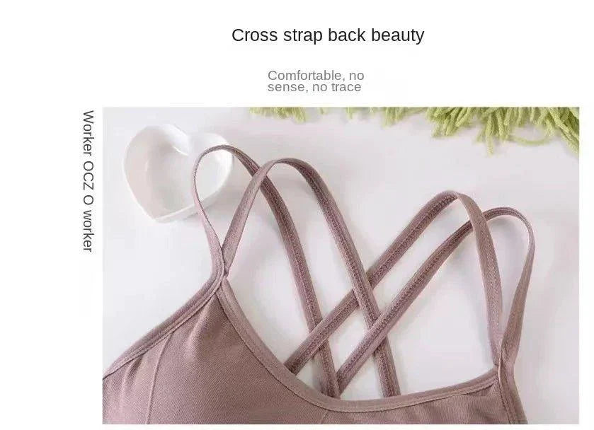 Mandotos women's sports bra with back cross straps, push-up design, breathable fabric, in solid color, suitable for yoga and running.