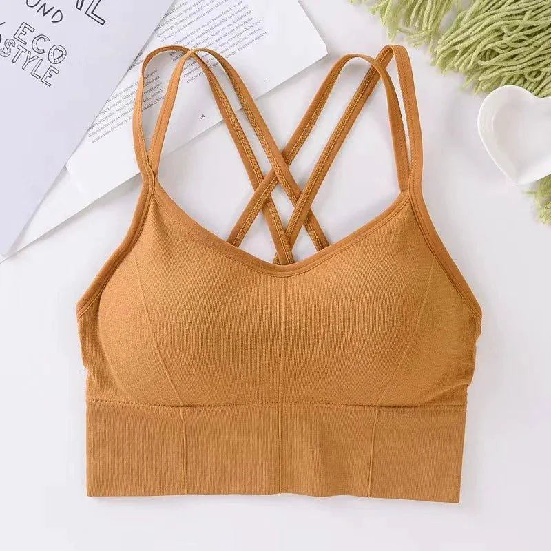 Mandotos women's breathable solid color sports bra with back cross straps, push-up design, ideal for running and yoga.