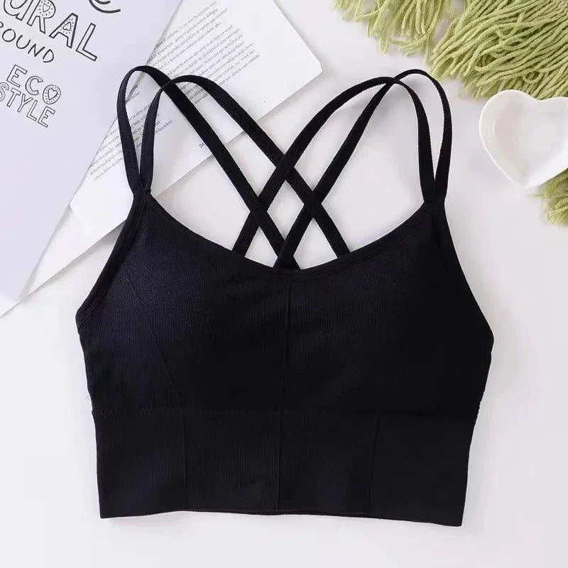 Mandotos women's sports bra with back cross straps, push-up design, breathable fabric, solid color, ideal for yoga and fitness.