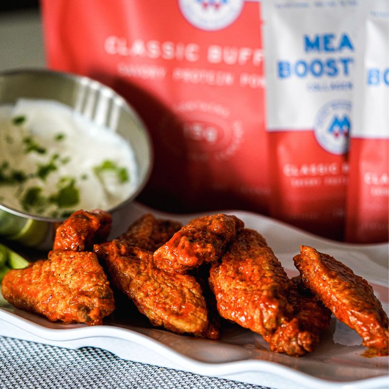 Classic Buffalo Collagen+ Protein Blend powder by Meal Boosters, showing the protein powder container with label details.