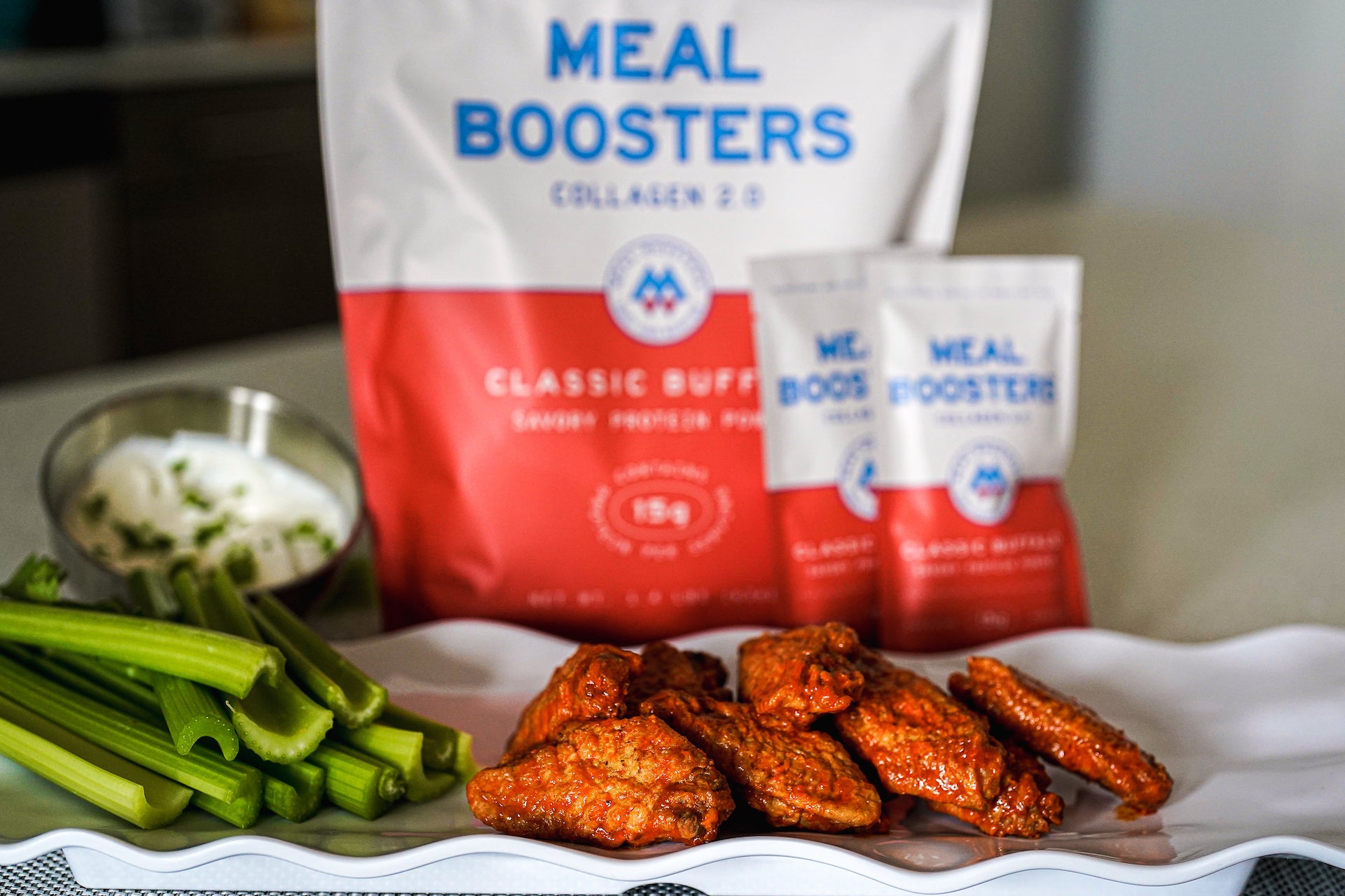 Classic Buffalo Collagen+ Protein Blend protein powder from Meal Boosters in a jar with a scoop and label.