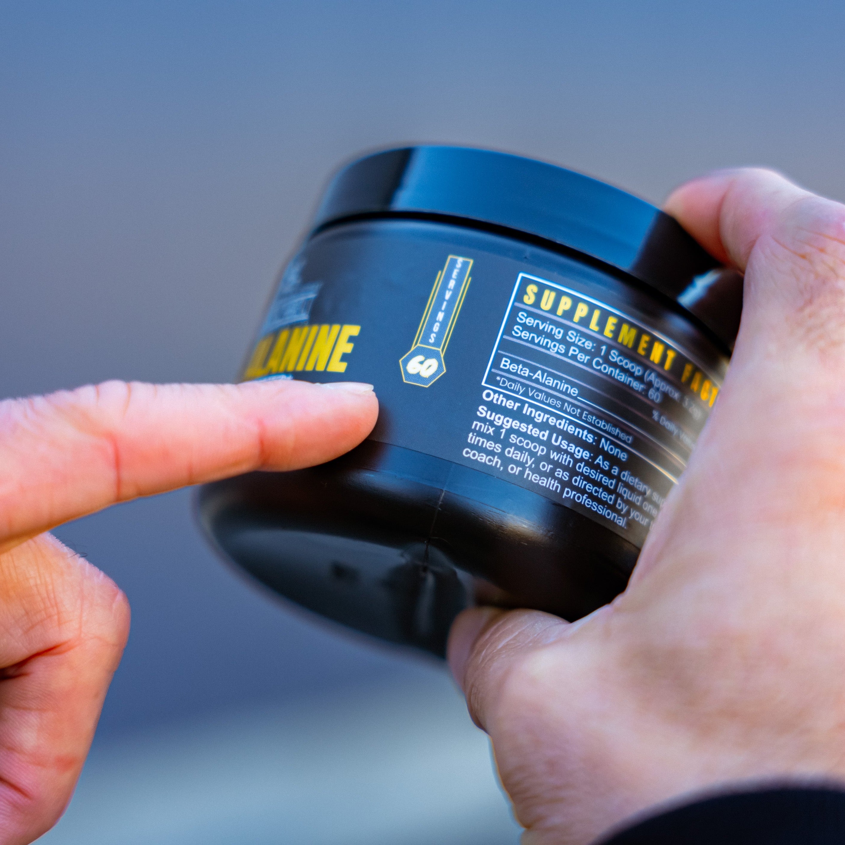 Blacklabel Supplements Beta-Alanine powder in a clear container with label, showing the product ready for use in fitness supplementation.