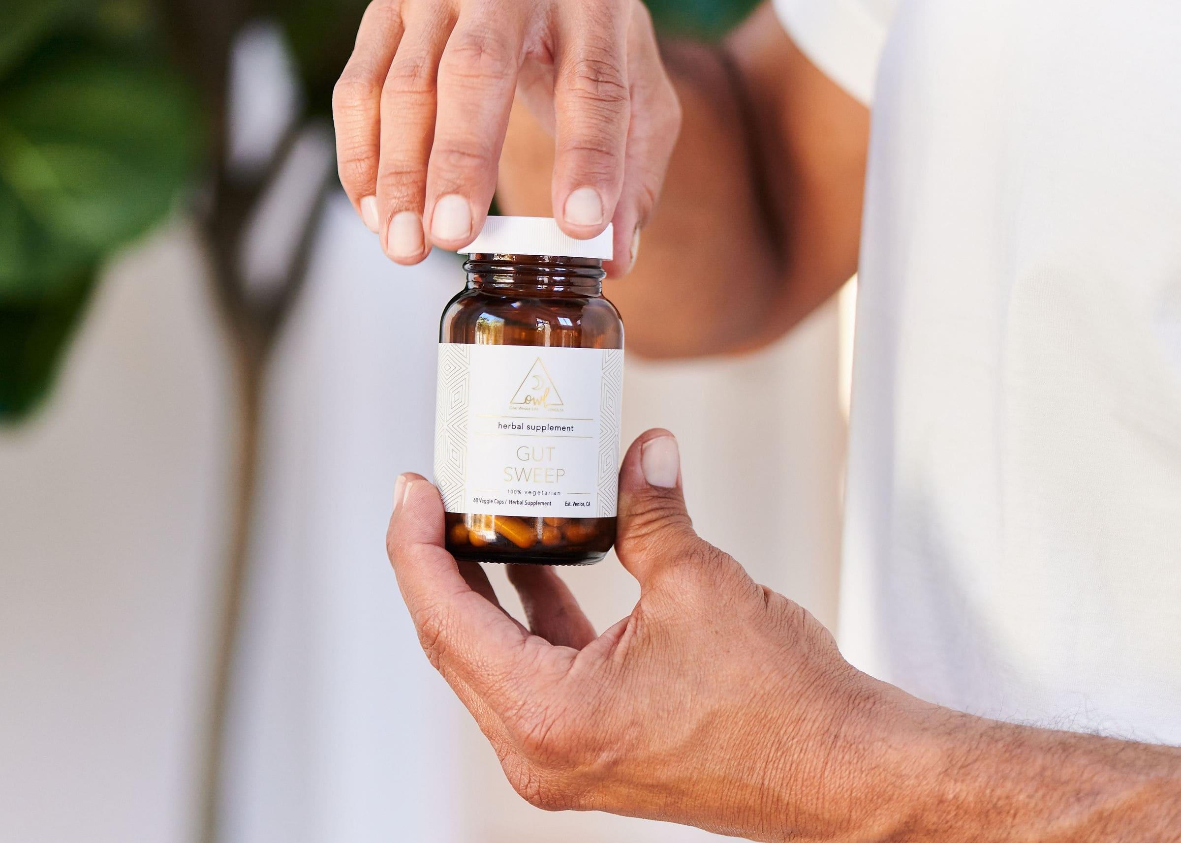 OWL Venice Gut Sweep herbal digestive wellness capsules featuring aloe vera, marshmallow root, and slippery elm blend in a bottle