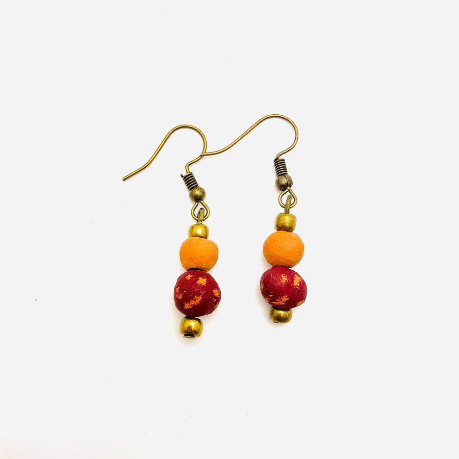 Antiqued cranberry-red aromatherapy earrings by Papillon Marketplace, featuring intricate design and elegant dangle style.