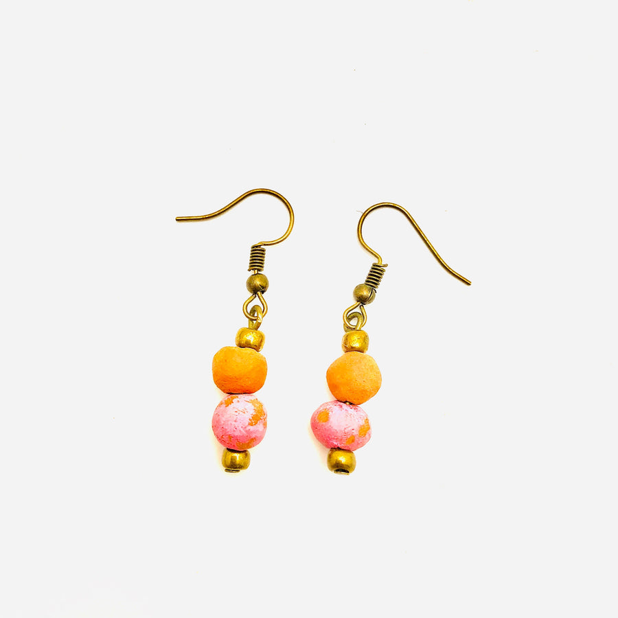 Antiqued cranberry-red aromatherapy earrings with intricate metalwork, crafted by Papillon Marketplace Online.