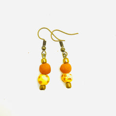 Antiqued cranberry red aromatherapy earrings with intricate design, crafted by Papillon Marketplace Online.