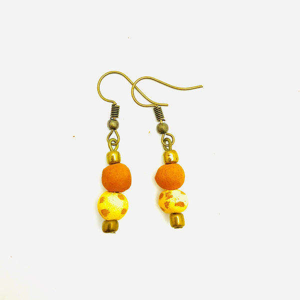 Antiqued cranberry red aromatherapy earrings with intricate design, crafted by Papillon Marketplace Online.