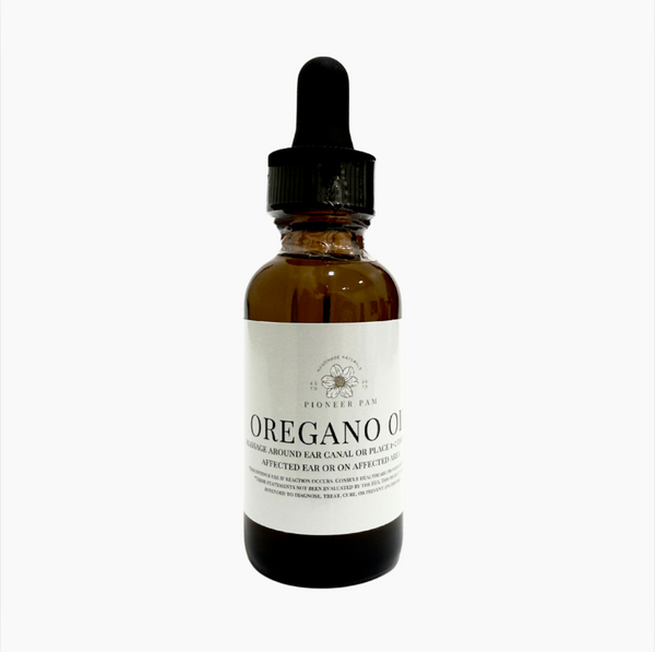 Pioneer Pam Oil of Oregano supplement bottle for immune and gut health support, with label showing product details.