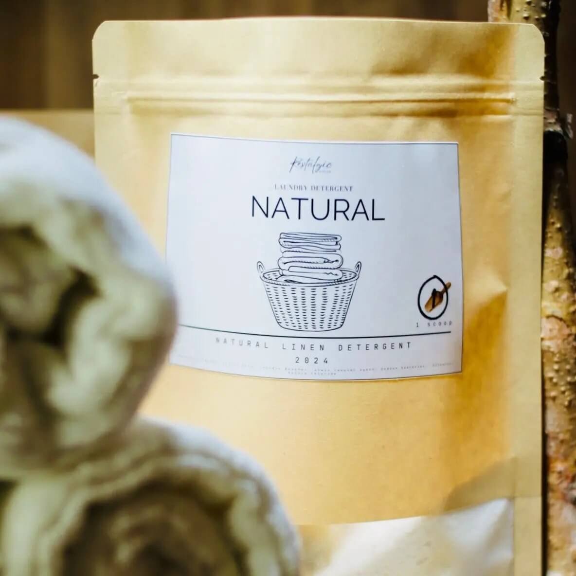 Restalgic Atelier natural organic vegan laundry detergent in 30oz bottle and 4lb container, eco-friendly and unscented for gentle cleaning.