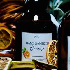 Restalgic Atelier organic foaming hand sanitizer with orange, peppermint, and bergamot in a 16oz bottle, featuring a pump dispenser.