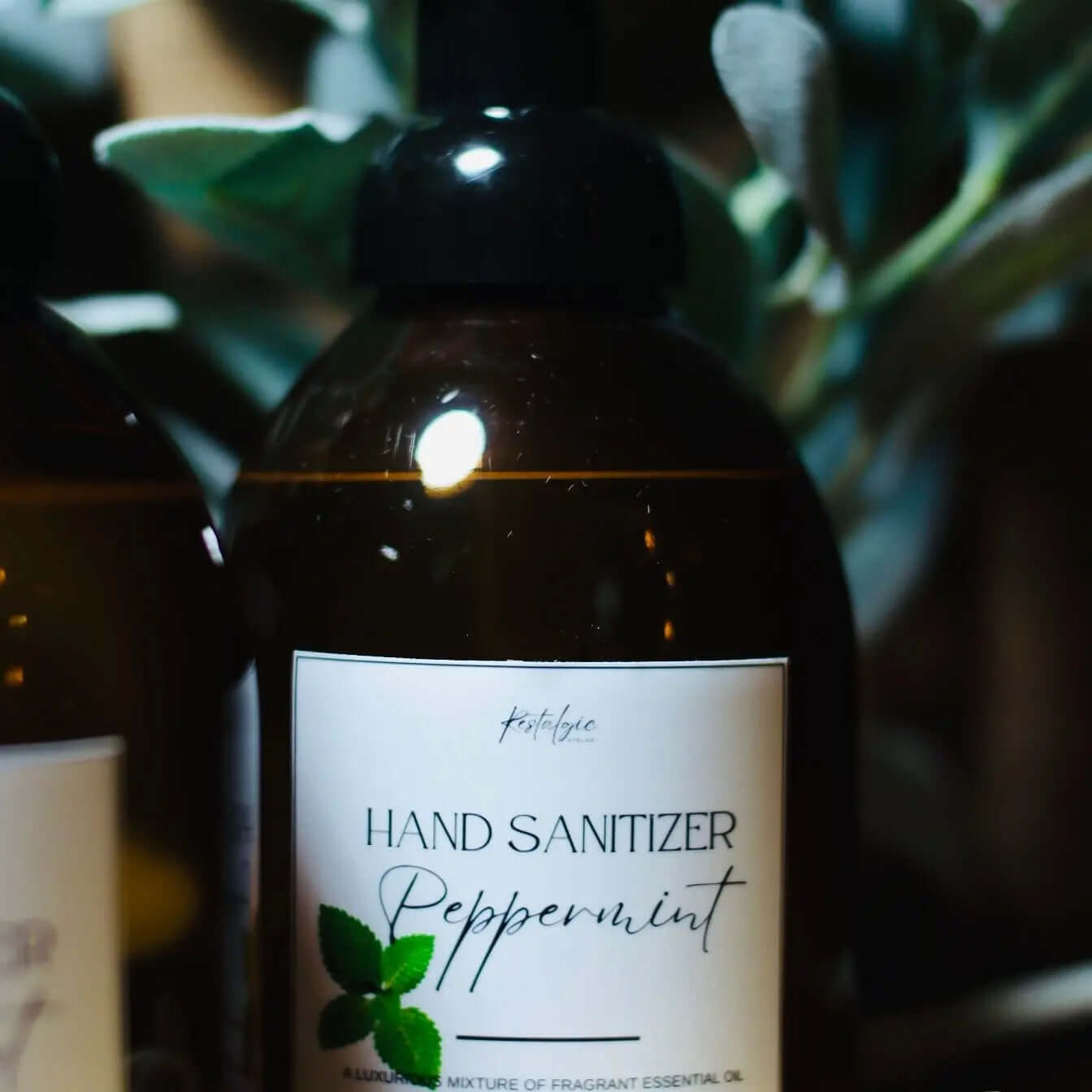 Restalgic Atelier organic foaming hand sanitizer in 16oz bottle with orange, peppermint, and bergamot scents, featuring a pump dispenser.