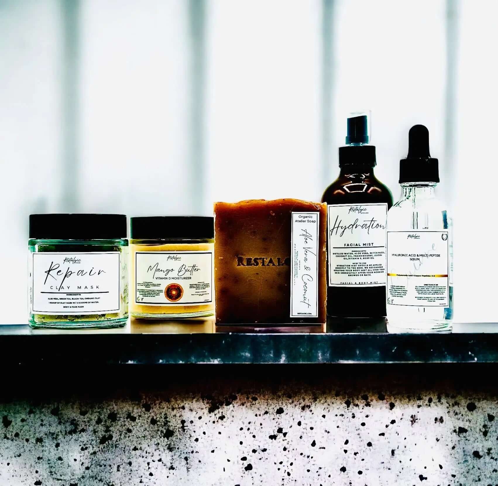 Restalgic Atelier Complete Acne Treatment Kit featuring skincare products for clear, flawless complexion.