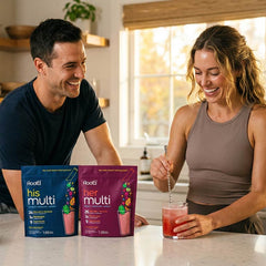 Root'd Couples’ Wellness Pack featuring hydrating multivitamins for her and him, shown in personalized bottles with colorful labels.