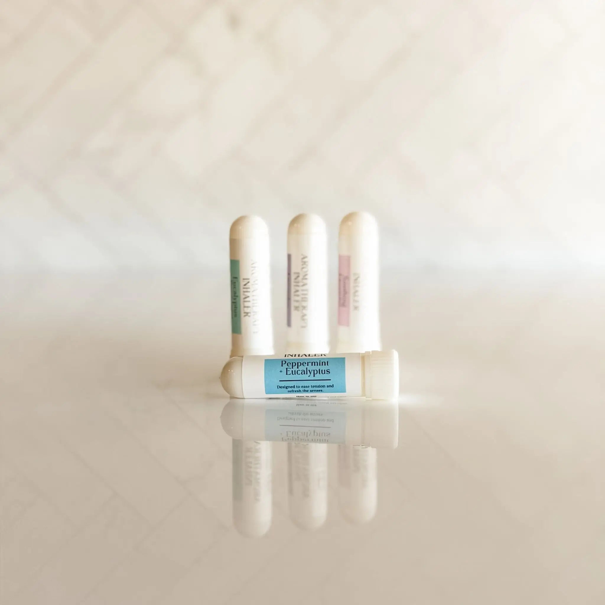 Peppermint and eucalyptus aroma nasal inhaler stick from Simply Stated Creations, used for aromatherapy and breathing relief.