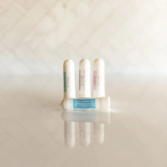 Peppermint and eucalyptus aroma nasal inhaler stick from Simply Stated Creations, used for aromatherapy and breathing relief.