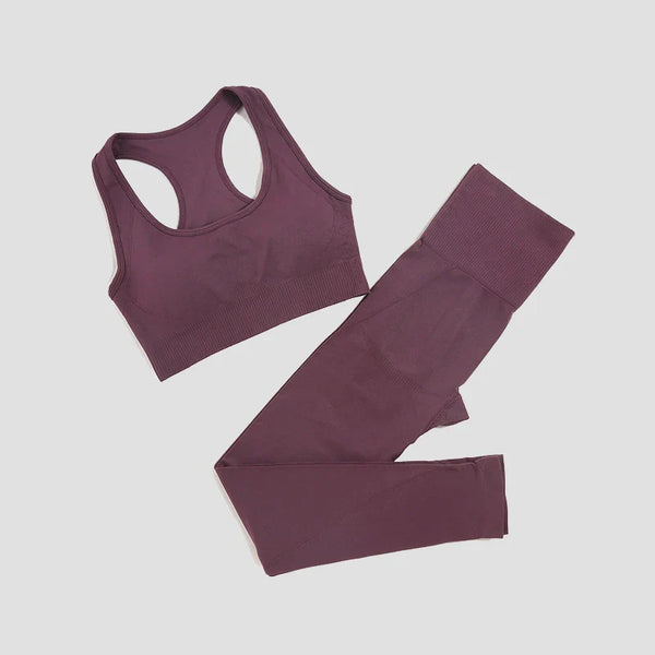 Seamless women's yoga set by THRIXINE, including a supportive sports bra and matching leggings in wine color for fitness and activewear.