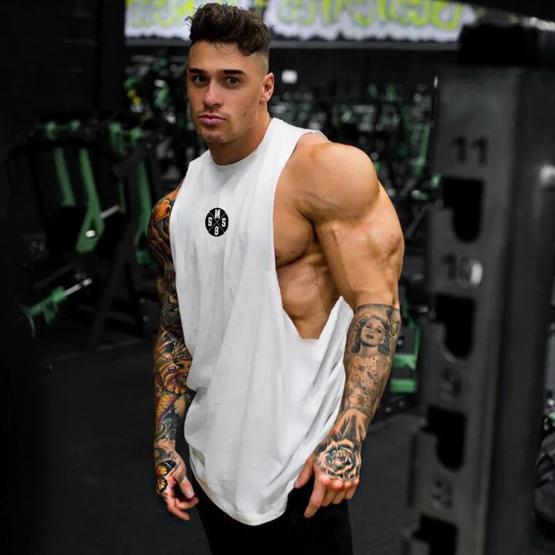 Black Thrixine muscle guys low cut fitness tank top for men, showcasing a fitted sleeveless design perfect for workouts.