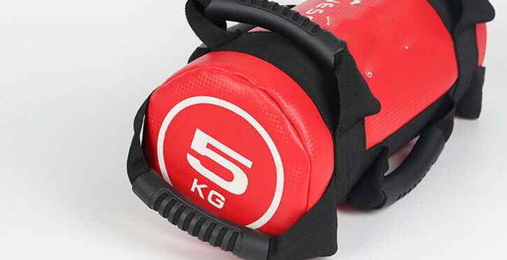 Vellmara 10kg red fitness energy pack used for physical fitness training and weight bearing exercises.