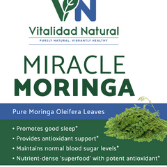 Fresh Moringa Pure supplement from Vitalidad Natural with vibrant green Moringa leaves and powder in a glass jar.