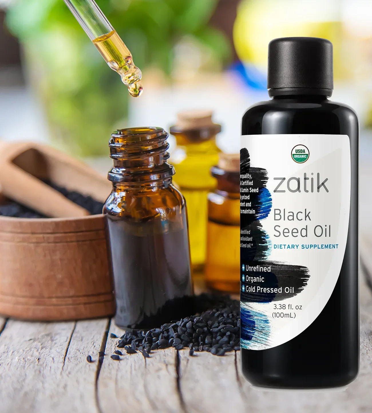 Dark glass bottle of Zatik Naturals Black Seed Oil for health care, with a label detailing its natural ingredients and benefits.